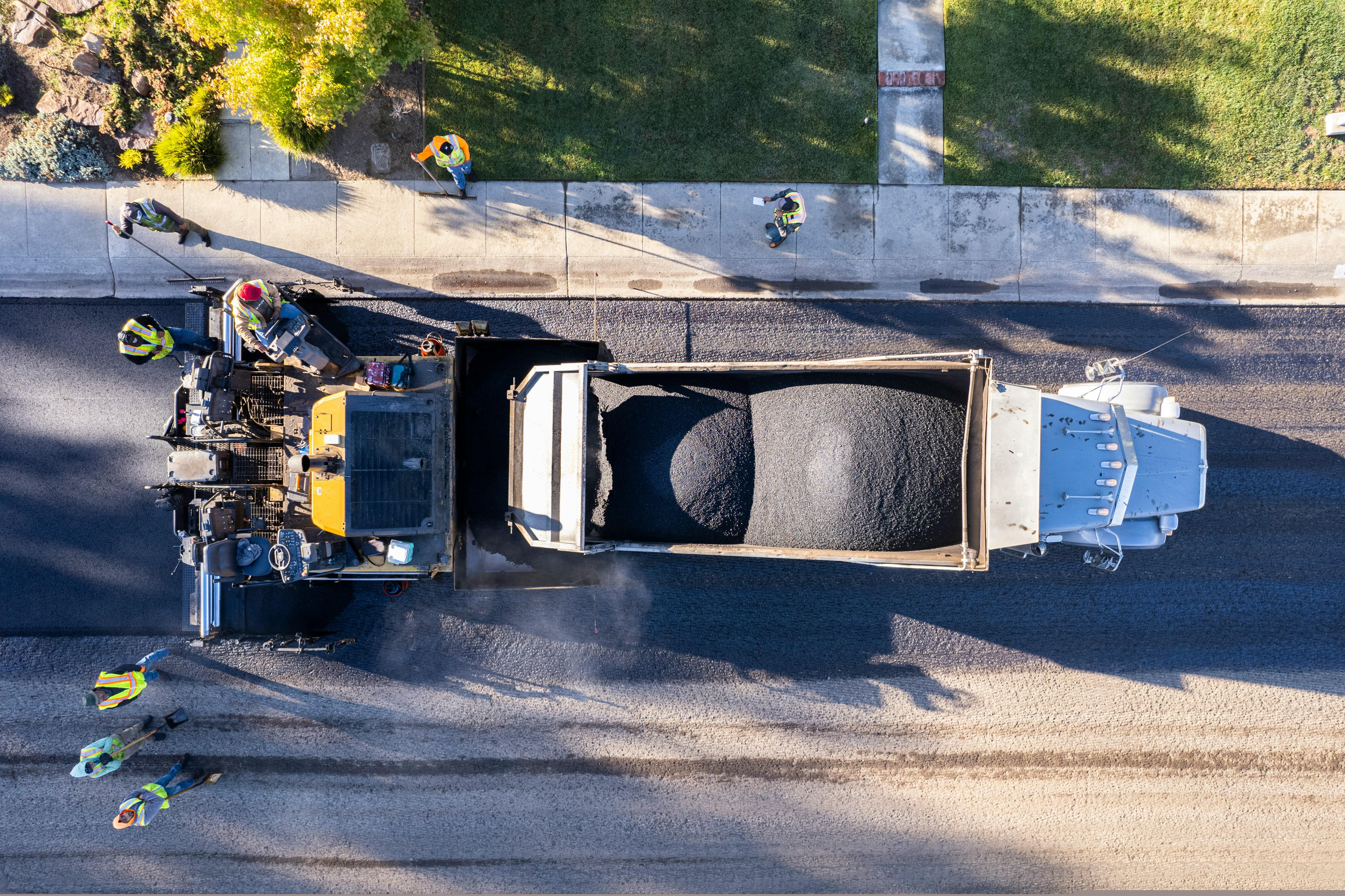 Asphalt milling equipment removing an old pavement surface before overlay