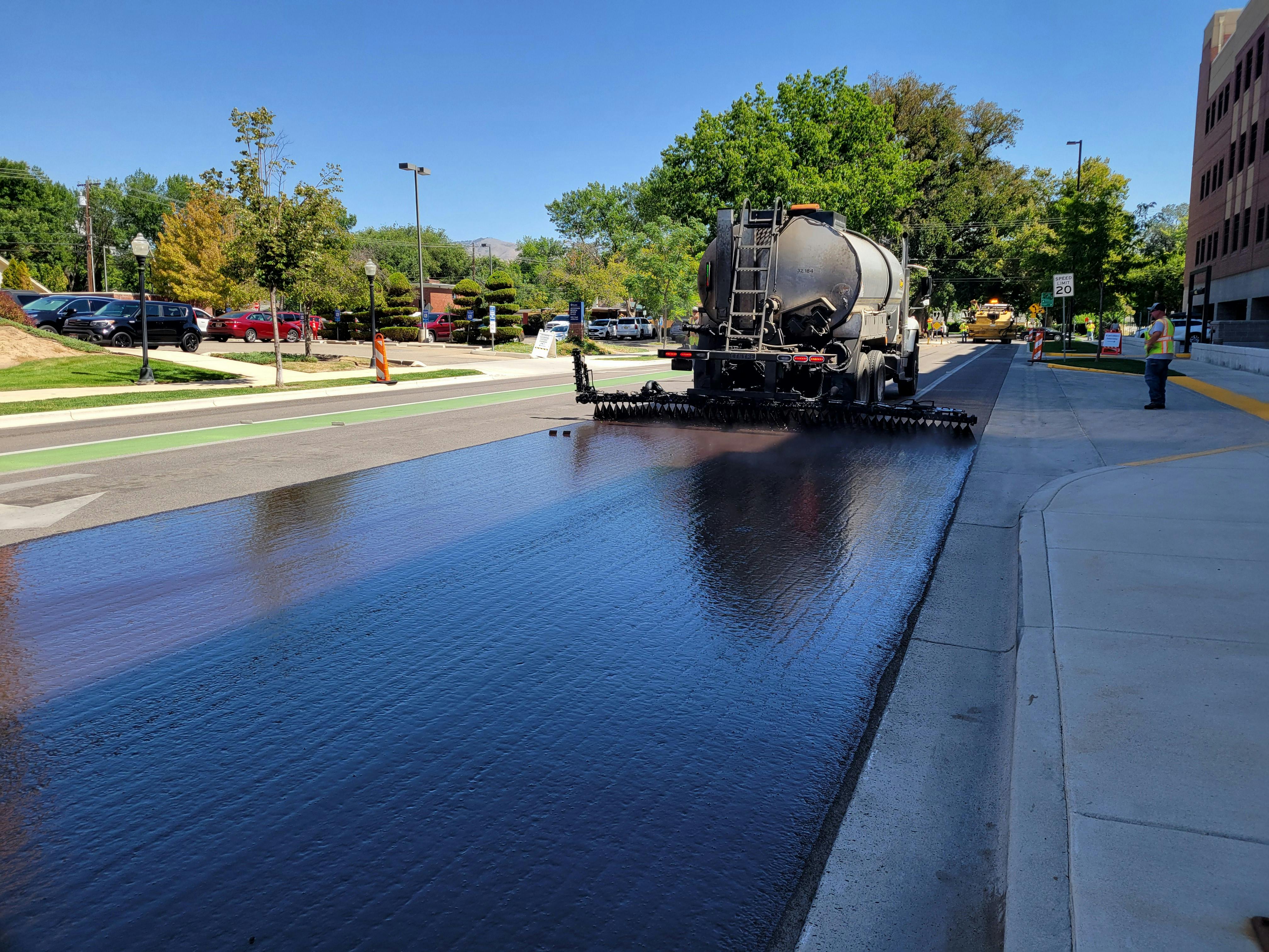 Commercial asphalt paving work on a large parking lot project